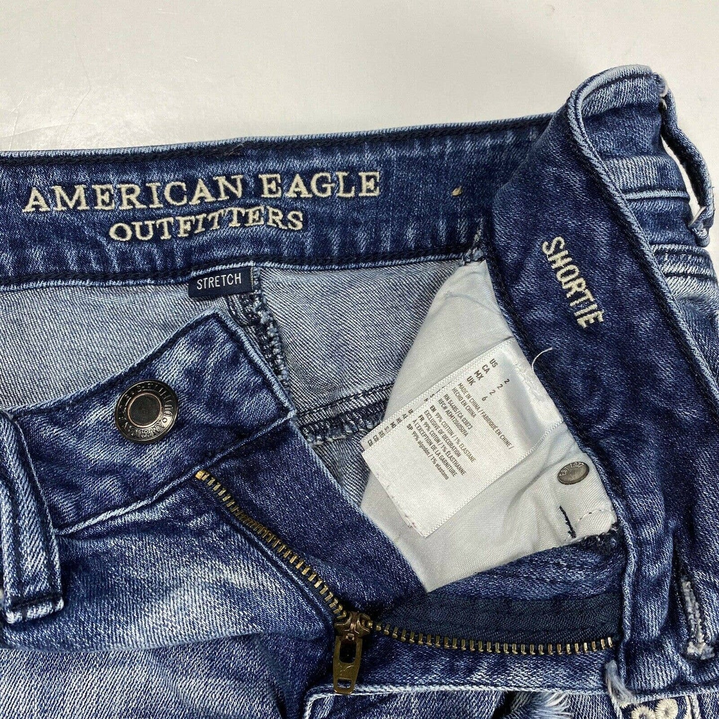 American Eagle Shortie Sz 2 Lowrise Stretch Denim Jean Shorts Raw Hem Embroidery