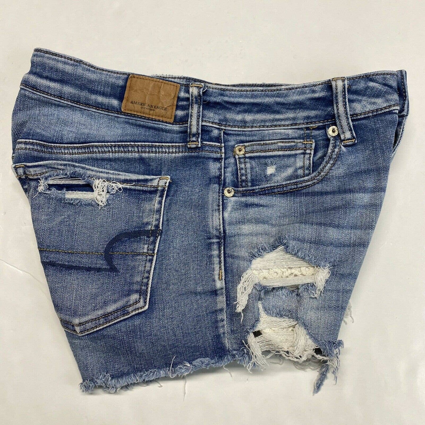 American Eagle Hi-Rise Shortie Sz 6 Next Level Stretch Denim Short Hole Fray EUC